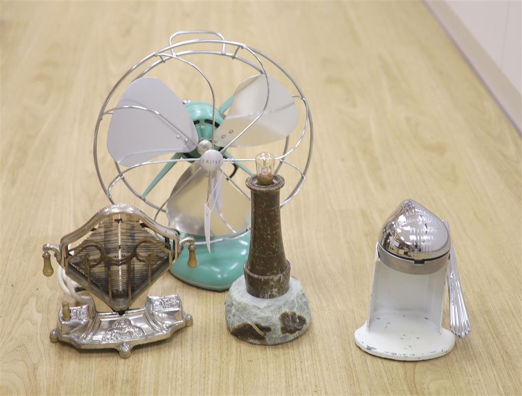 Early 20th century metal toaster and electric fan and lighthouse lamp and juicer